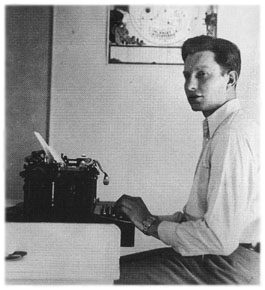 [18-year-old Ron seated at typewriter]